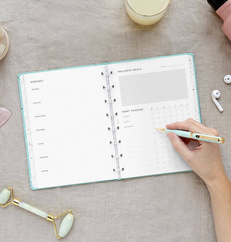 Wellness Tracker Notebook Refill in A5 size on desk - fits Filofax Refillable Notebooks