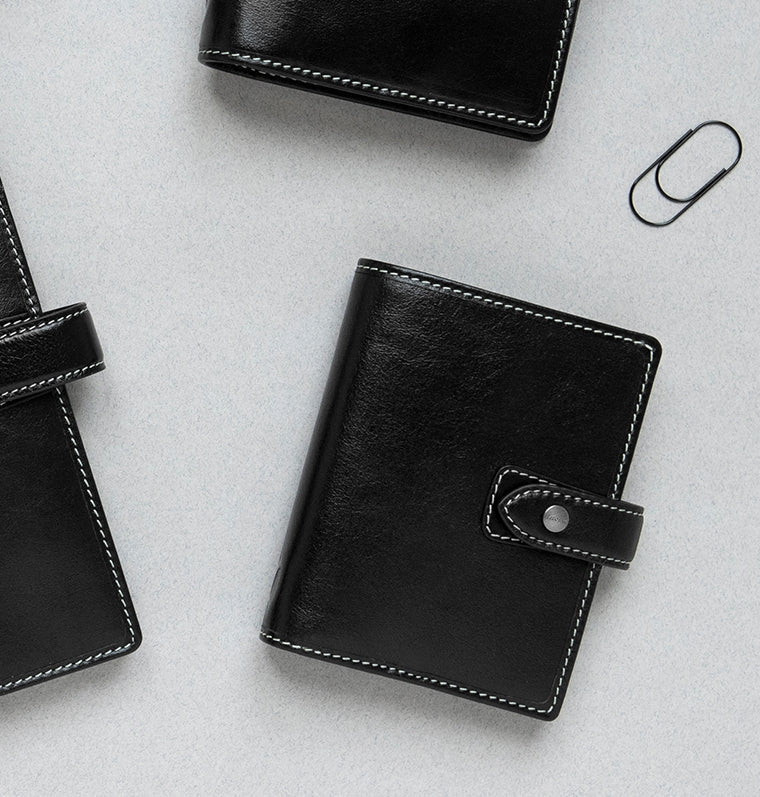 Filofax Leather Malden Pocket Organiser in Black on desk
