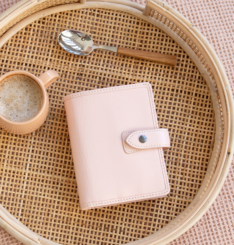 Filofax Leather Malden Pocket Organiser in Pink - on table
